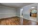 Living room featuring hardwood floors and neutral paint, showing doorway into kitchen at 2270 Cresta Dr, Decatur, GA 30032