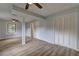 Spacious living room with light-colored walls, laminate floors, ceiling fans and access to doors at 2270 Cresta Dr, Decatur, GA 30032