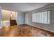 Living room featuring hardwood floors, staircase, and neutral paint and large window at 2270 Cresta Dr, Decatur, GA 30032