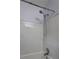 Bathroom shower and tub with bright white tile and chrome shower head at 2270 Cresta Dr, Decatur, GA 30032
