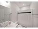 Clean bathroom includes a sink, toilet, shower with black and white striped curtain at 3323 Owl Creek Pkwy, Acworth, GA 30102