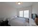 Cozy bedroom boasts soft natural light from two bright windows at 3323 Owl Creek Pkwy, Acworth, GA 30102