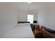 Well-lit bedroom features a bed, desk, and comfortable seating area at 3323 Owl Creek Pkwy, Acworth, GA 30102