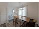 Bright dining area with a wooden table, modern chandelier, and large window at 3323 Owl Creek Pkwy, Acworth, GA 30102