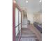 Inviting home foyer with wood-look flooring, staircase, and an open view into the living area, creating a welcoming entrance at 3323 Owl Creek Pkwy, Acworth, GA 30102