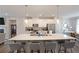 Bright kitchen with stainless steel appliances, white cabinets, and central island at 3323 Owl Creek Pkwy, Acworth, GA 30102
