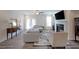 Bright living room with hardwood floors, fireplace, stylish furniture, and access to a balcony through French doors at 3323 Owl Creek Pkwy, Acworth, GA 30102