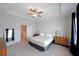 Large bedroom with a ceiling fan, two dressers, and a view into the hall at 3323 Owl Creek Pkwy, Acworth, GA 30102