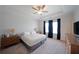 Bright main bedroom with a king bed, dark curtains, and neutral-toned walls and carpet at 3323 Owl Creek Pkwy, Acworth, GA 30102