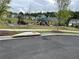 Community playground with slides and benches with townhomes in the background at 3323 Owl Creek Pkwy, Acworth, GA 30102