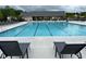 Community pool with lounge chairs, tables, and chairs for residents to enjoy at 3323 Owl Creek Pkwy, Acworth, GA 30102