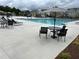 Large community pool with lounge chairs and tables and chairs for residents at 3323 Owl Creek Pkwy, Acworth, GA 30102