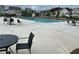 Large community pool with lounge chairs and tables and chairs for residents at 3323 Owl Creek Pkwy, Acworth, GA 30102