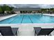 Community pool with lounge chairs, tables, and chairs for residents to enjoy at 3323 Owl Creek Pkwy, Acworth, GA 30102