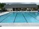 Swimming pool showing the no diving end of the pool with a covered pavilion and chairs in the background at 3323 Owl Creek Pkwy, Acworth, GA 30102
