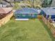Green backyard featuring a lush lawn and a wooden fence at 1385 Benteen Se Way, Atlanta, GA 30315