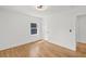 Well-lit bedroom featuring hardwood floors, white walls, and modern ceiling fan at 1385 Benteen Se Way, Atlanta, GA 30315
