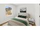 Cozy bedroom featuring a queen-size bed with green accents and natural light from a window at 1385 Benteen Se Way, Atlanta, GA 30315