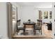 Bright dining area featuring modern table set, hardwood floors and neutral decor at 1385 Benteen Se Way, Atlanta, GA 30315