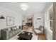 Bright living room showcasing hardwood floors, contemporary furniture, and natural light streaming through the windows at 1385 Benteen Se Way, Atlanta, GA 30315