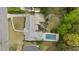 Aerial view of the property showcasing the house, driveway, landscaping, and swimming pool at 1724 Ridge Valley Nw Ct, Atlanta, GA 30327