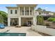 Rear exterior view showing the house, patio, swimming pool, and landscaped yard at 1724 Ridge Valley Nw Ct, Atlanta, GA 30327