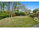 Expansive backyard with a well-maintained lawn and lush trees at 1724 Ridge Valley Nw Ct, Atlanta, GA 30327