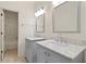 Bathroom featuring double sinks, marble countertops and vanity at 1724 Ridge Valley Nw Ct, Atlanta, GA 30327