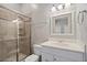 Bathroom featuring a glass shower, vanity and updated fixtures at 1724 Ridge Valley Nw Ct, Atlanta, GA 30327