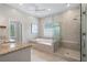 Luxurious bathroom features a standalone tub, glass-enclosed shower, and double vanity at 1724 Ridge Valley Nw Ct, Atlanta, GA 30327