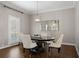 Elegant dining room featuring a round table, designer chandelier, and stylish window shutters at 1724 Ridge Valley Nw Ct, Atlanta, GA 30327