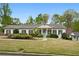 Inviting single-story home with lush landscaping and a welcoming entrance at 1724 Ridge Valley Nw Ct, Atlanta, GA 30327