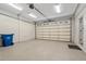 Spacious garage with epoxy flooring and white walls, offering ample parking at 1724 Ridge Valley Nw Ct, Atlanta, GA 30327