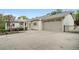Exterior view of the house with a large garage and concrete driveway at 1724 Ridge Valley Nw Ct, Atlanta, GA 30327