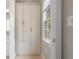 Hallway featuring built in floor-to-ceiling storage cabinets and a window with natural light at 1724 Ridge Valley Nw Ct, Atlanta, GA 30327