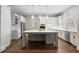 Spacious kitchen with a large center island, stainless steel appliances, and custom white cabinetry at 1724 Ridge Valley Nw Ct, Atlanta, GA 30327