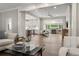 Open-concept living room flowing into the kitchen and featuring a cozy fireplace at 1724 Ridge Valley Nw Ct, Atlanta, GA 30327