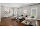 Bright and airy living room with neutral decor, hardwood floors, and elegant furnishings at 1724 Ridge Valley Nw Ct, Atlanta, GA 30327