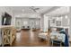 Spacious living room featuring hardwood floors, neutral colors, and an open floor plan to the kitchen at 1724 Ridge Valley Nw Ct, Atlanta, GA 30327