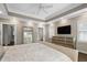 Spacious main bedroom featuring a tray ceiling, large windows, and a dresser at 1724 Ridge Valley Nw Ct, Atlanta, GA 30327