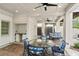 Covered patio with ceiling fans, outdoor seating, and a backyard view at 1724 Ridge Valley Nw Ct, Atlanta, GA 30327