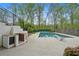 Inviting backyard pool and outdoor kitchen area for summer fun at 1724 Ridge Valley Nw Ct, Atlanta, GA 30327