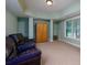 Relaxing finished basement space featuring an oversized leather couch and a window with natural light at 981 Cranbrook Glen Ln, Snellville, GA 30078