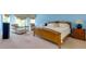 Relaxing main bedroom featuring light-blue walls, seating area, and a large bed at 981 Cranbrook Glen Ln, Snellville, GA 30078