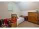 Cozy bedroom featuring natural light, a bed, and a dresser for storage at 981 Cranbrook Glen Ln, Snellville, GA 30078