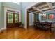 Dining room with hardwood floors, coffered ceiling, and french doors that let in ample natural light at 981 Cranbrook Glen Ln, Snellville, GA 30078