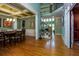 Elegant dining room featuring hardwood floors, coffered ceiling, and staircase with iron spindles at 981 Cranbrook Glen Ln, Snellville, GA 30078