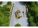 Aerial view of gatehouse entrance to a gated community with landscaping at 981 Cranbrook Glen Ln, Snellville, GA 30078