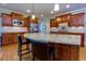 Well-appointed kitchen with custom cabinetry, stainless steel appliances, and a granite-topped center island at 981 Cranbrook Glen Ln, Snellville, GA 30078