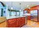 Beautiful kitchen island with stainless appliances, and custom wood cabinets. Granite countertops at 981 Cranbrook Glen Ln, Snellville, GA 30078